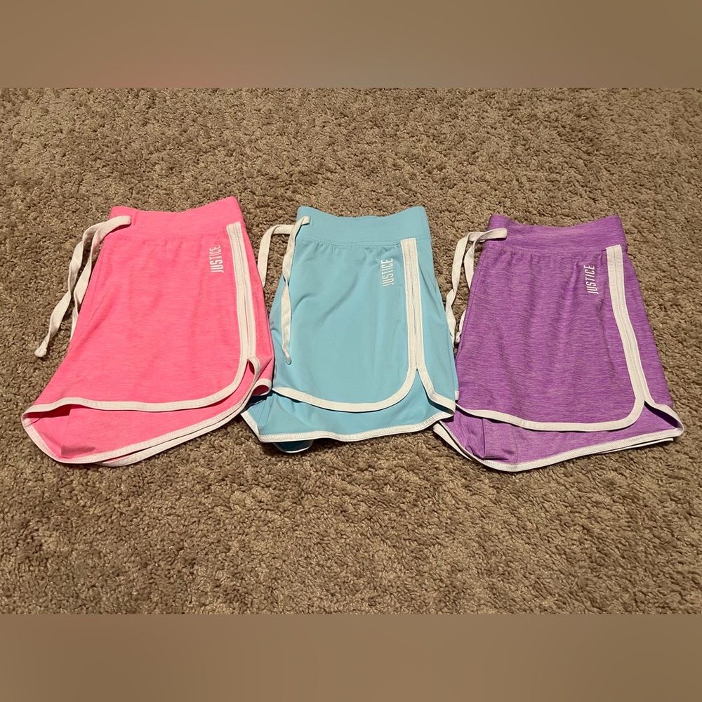 Justice Girls' Athletic Dolphin Shorts Trio in Pink, Blue, and Purple